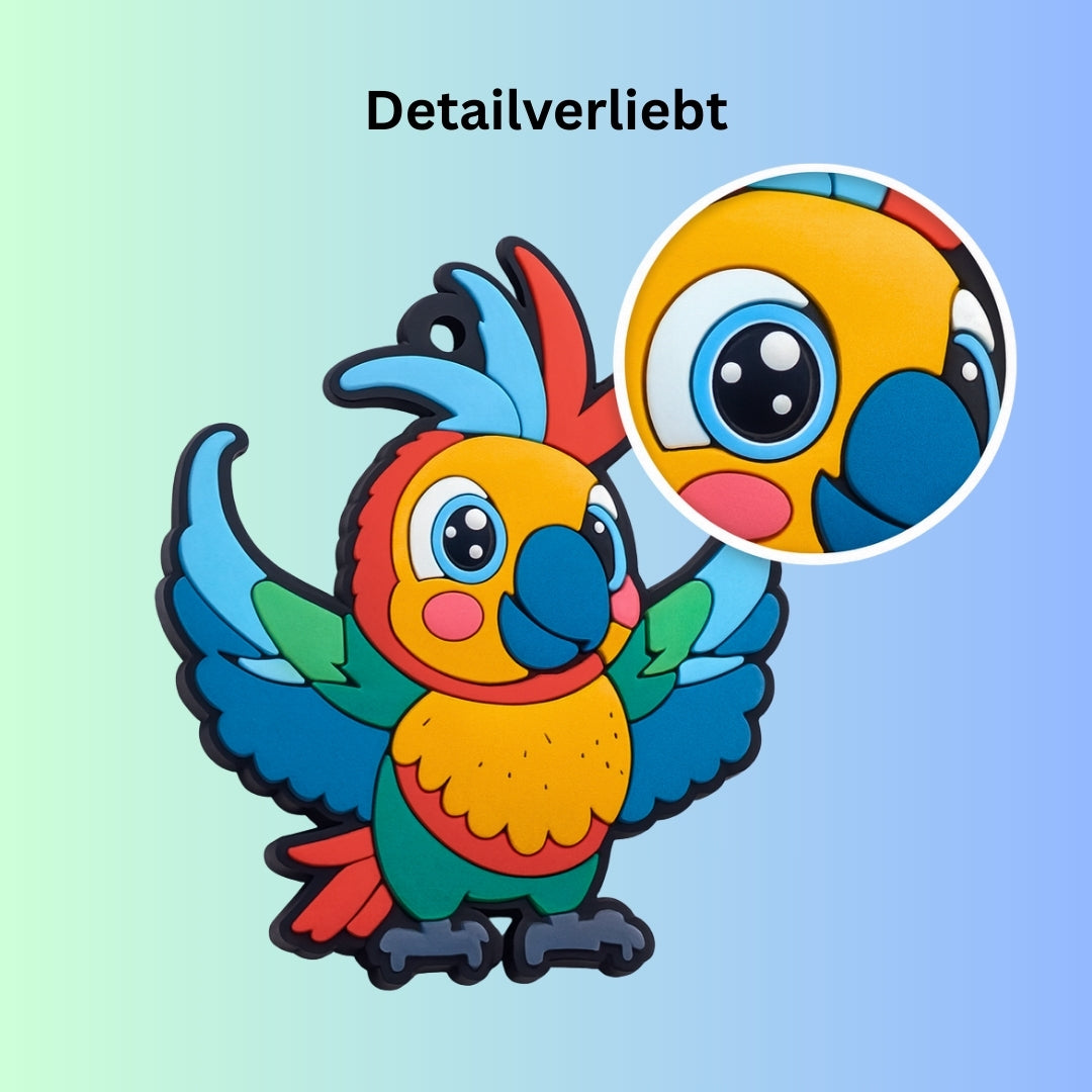 Papagei Schlüsselsanhänger Detailaufnahme der Augen auf blau-grünem Farbverlauf Hintergrund